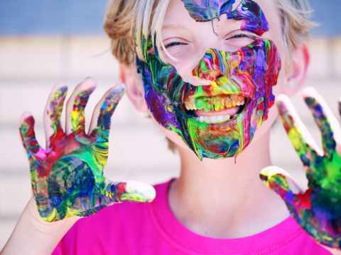 Weekend Event Guide | Friday 13 May-Sunday 15 May 2022 boy in pink crew neck top with paints on his hands and face