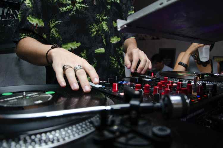man playing music mixer and dj mixer