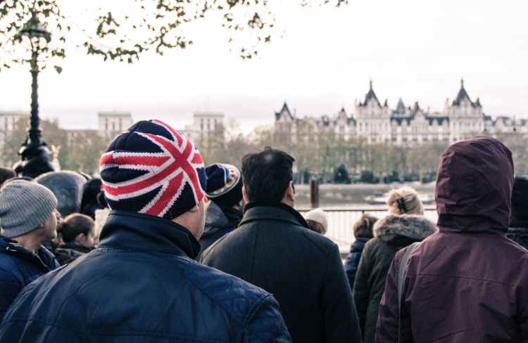 Crispin Hull / Misuse of Power, Wealth and Politics photo of group of people standing in front of building